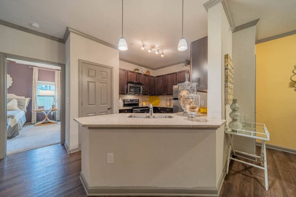 a kitchen with a counter top and a sink